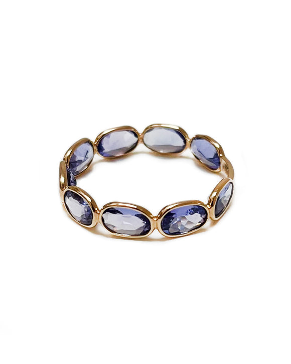 oval cut tanzanite and yellow gold ring